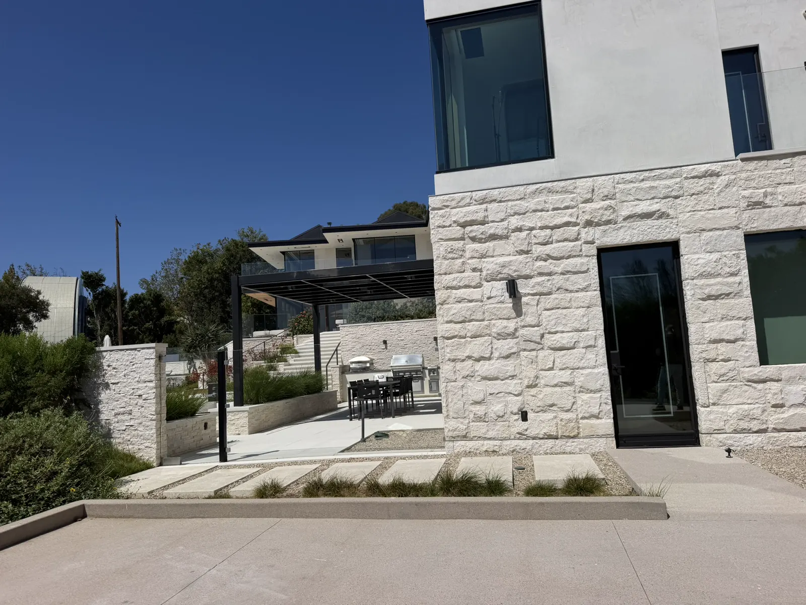 Modern residence with black-framed glass doors and windows