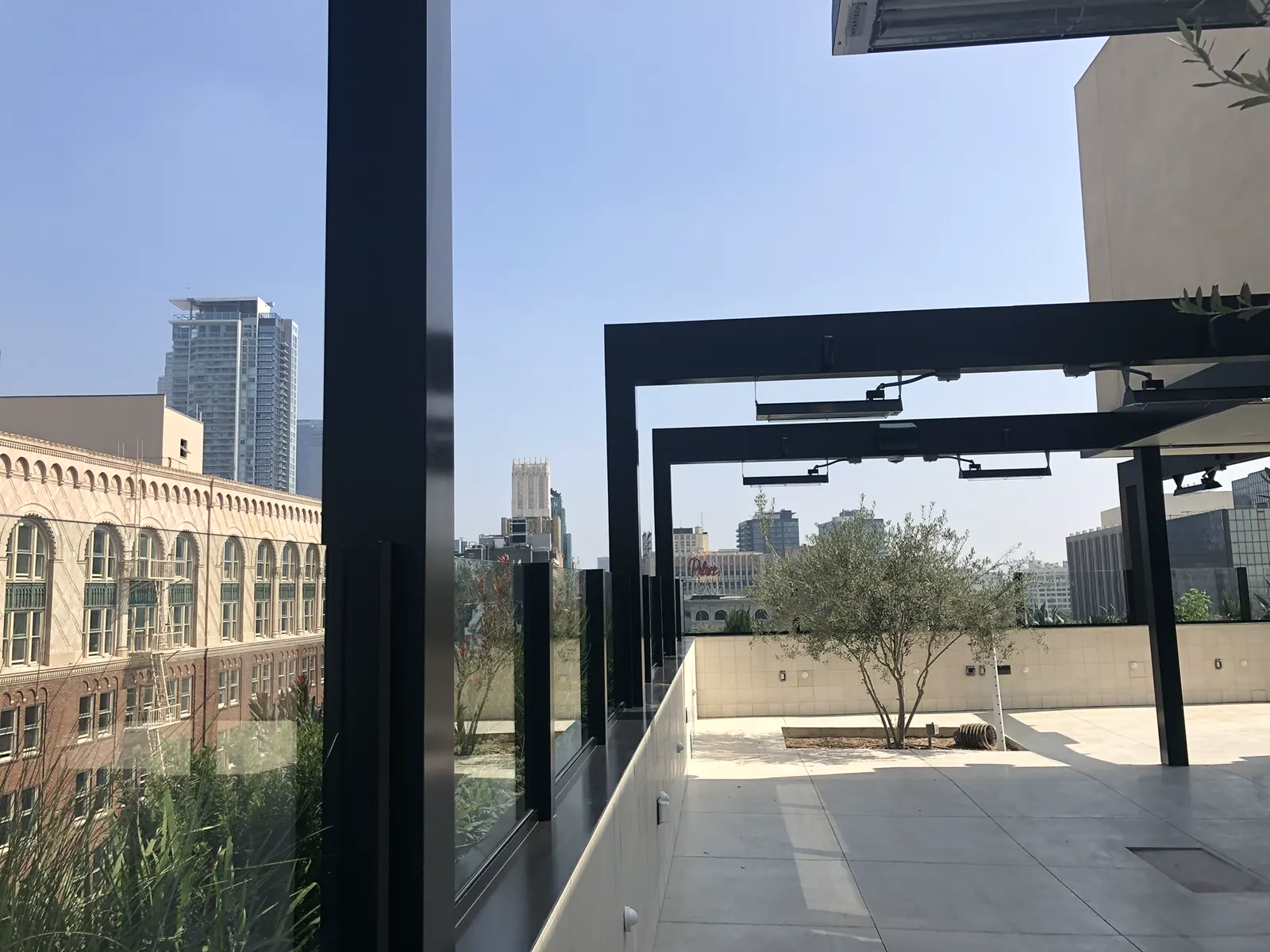 Rooftop terrace glass railing with black posts